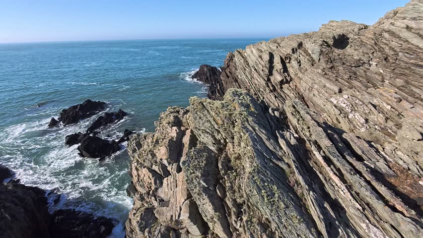 Eroded rocky cliff edge Welsh island rugged coastal headland and Irish seascape