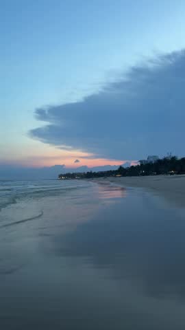Sunset over calm ocean with peaceful seascape