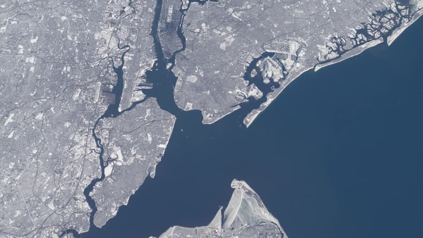 Flying over New York Manhattan winter snow cityscape satellite view from space based on Nasa imagery