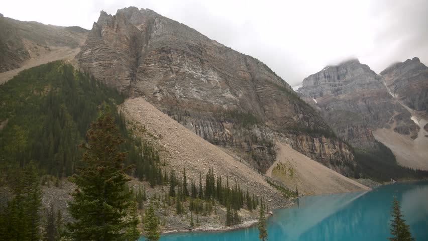 Majestic view of the turquoise Moraine Lake and the Valley of the Ten Peaks in Banff National Park, Alberta, Canada. Road trip in Canada. Rocky mountains. 4k footage.