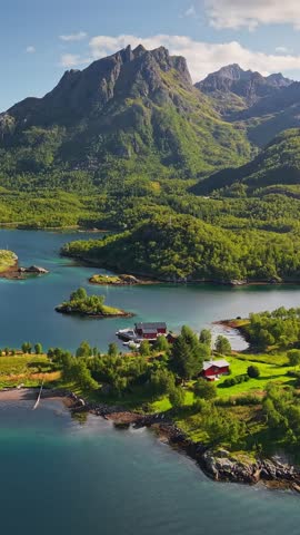 Vertical aerial panorama of the Lofoten archipelago, stunning turquoise water and green mountains. Summer in the Lofoten islands with crystal clear sea, vertical view of the wild nature in Norway