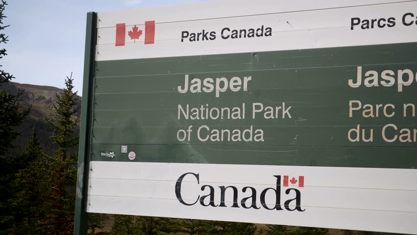 Welcome board of Jasper National Park of Canada along the scenic Icefields Parkway. Road trip in Canada. Rocky mountains. 4k footage