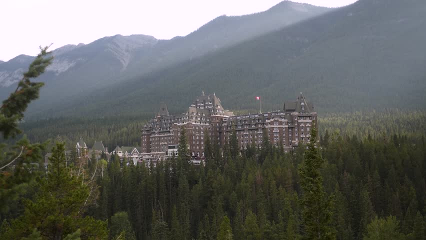 Luxury Historic Fairmont Banff Springs Hotel with majestic Mount Ruddle in the background, Banff National Park, Alberta, Canada. Road trip in Canada. Rocky mountains. 