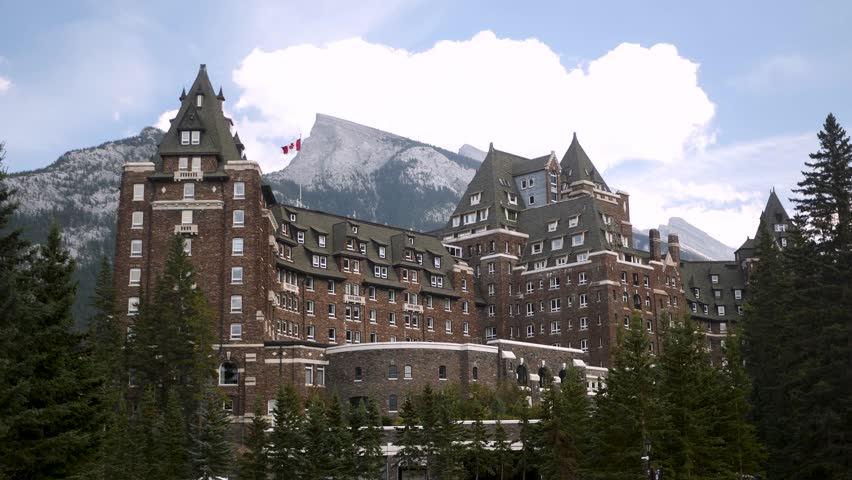 Luxury Historic Fairmont Banff Springs Hotel with majestic Mount Ruddle in the background, Banff National Park, Alberta, Canada. Road trip in Canada. Rocky mountains. 