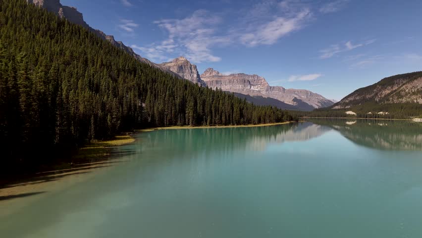 Majestic mountain peaks, glaciers, turquoise lakes along the scenic Icefields Parkway between Banff and Jasper National Parks, Alberta, Canada. Road trip in Canada. Rocky mountains. 4k footage
