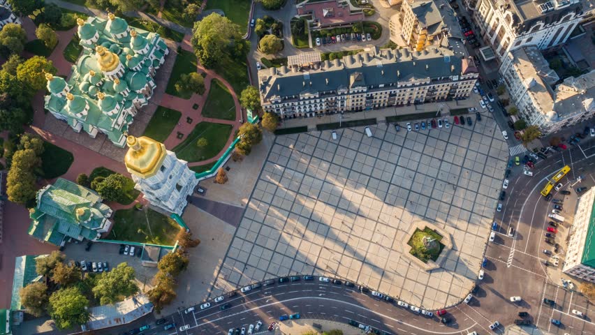 Aerial top down time lapse of Sofia Square in Kyiv, busy city life and moving shadows near the ancient cathedral. Majestic St. Sophia Cathedral and the main square of Kyiv, Ukraine