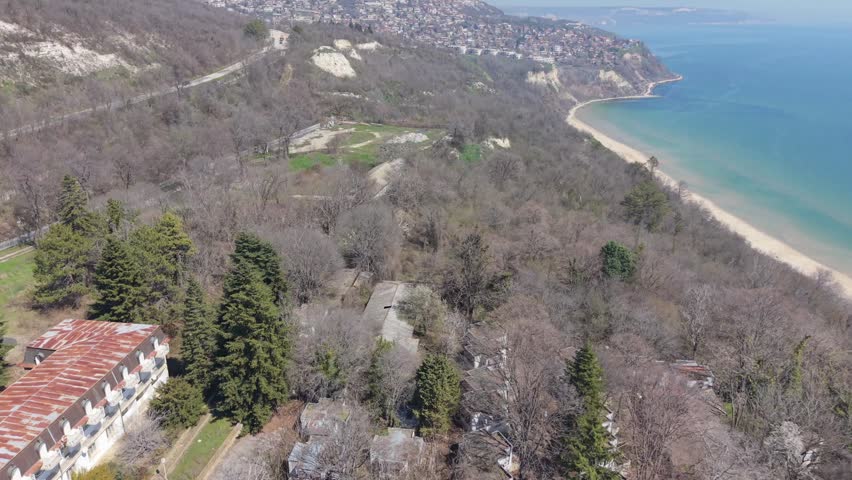 Aerial landscape of coastline with beach and city stretching along the sea