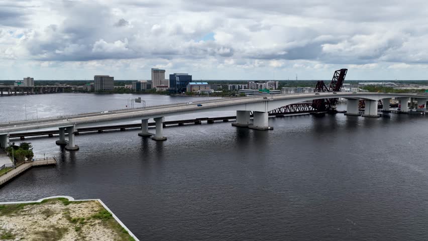 Aerial footage of cars driving over a bridge on the St Johns River in Jacksonville Florida USA