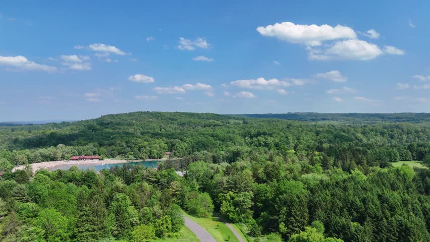 A beautiful breathtaking state park, a beach front full of people, and an amazing lake.