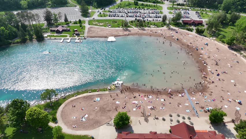 Numerous people can be seen just simply trying to get a tan along this state park beach front now that winter is over.