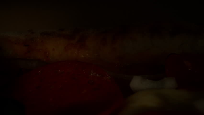 Revealing Fresh Salami Pizza in Slow Motion, Close Up to Wide Motion Control Shot.