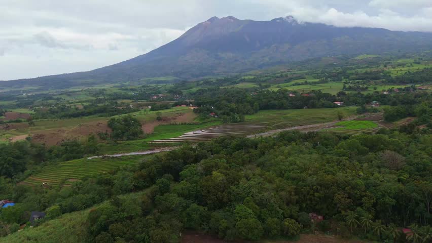 Aerial look at the lush tropical valley and hills at the base of Mount Canlaon in Canlaon City, Negros Oriental, Philippines. Fertile volcanic land and remote terrain