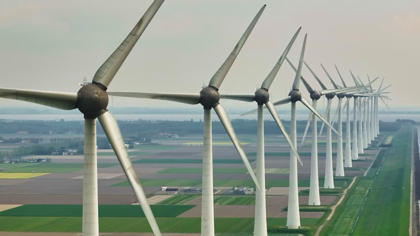Aerial view of offshore windmill park with blue sky, windmill park in the sea, aerial view of wind turbine, Netherlands