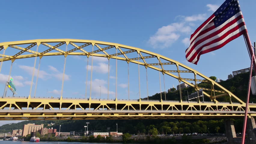 The yellow Fort Pitt Bridge over the Monongahela River in downtown Pittsburgh,