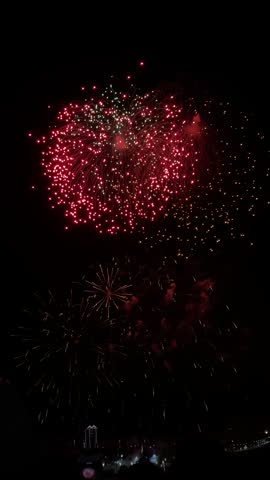 Colorful fireworks exploding in night sky during celebration event
