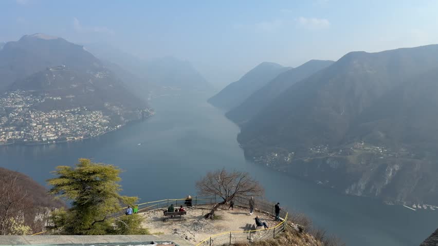 Panoramic view of Lugano city and Lake Lugano from Monte San Salvatore, Switzerland, urban and mountain landscape