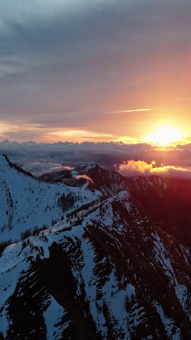Awe-inspiring sunset over snow-covered mountain landscape