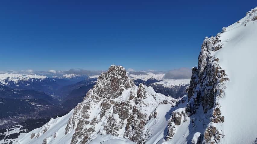 Massif snowcapped mountain peak by winter in French alps