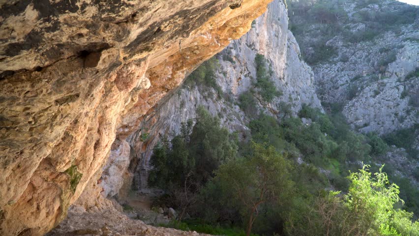 Water drops falling from the rocks in a cave	