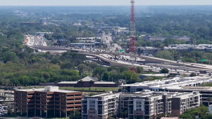 Aerial footage of cars driving on a highway in Jacksonville Florida USA