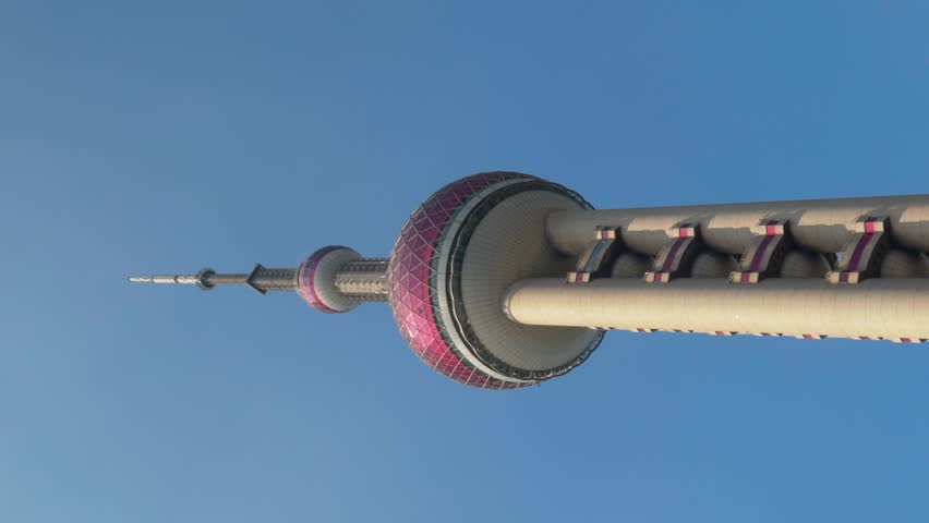 Pearl Tower Shanghai. Timelapse video of Shanghai iconic Oriental Pearl Tower in Lujiazui Pudong China with city lights moving cloud and urban traffic. Travel tourism and landmark city skyline concept