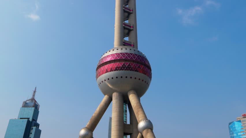 Pearl Tower Shanghai. Timelapse video of Shanghai iconic Oriental Pearl Tower in Lujiazui Pudong China with city lights moving cloud and urban traffic. Travel tourism and landmark city skyline concept