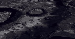 The lunar surface showcases a detailed landscape filled with numerous craters and geological formations. The scene captures the unique textures and shadows created by sunlight on the moons surface. - Powered by Shutterstock - Get 15% off with code: PIKWIZARD15