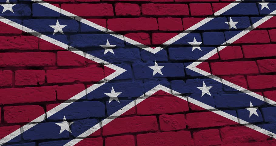 A panning video of a brick wall with the Confederate state flag of the United States of America