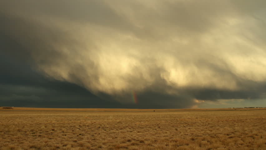 Rainbow and Storm Clouds over Meadow in eastern Colorado. HD 1080p timelapse.