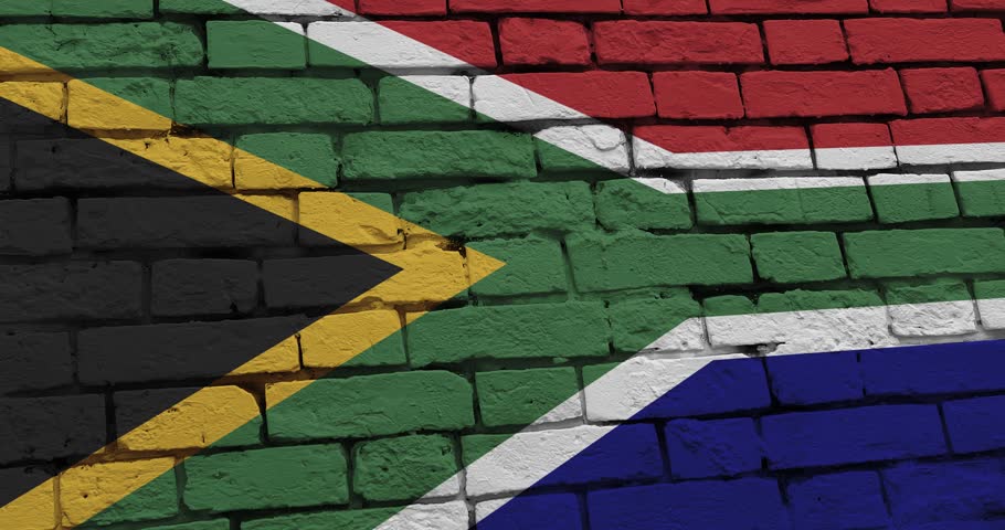A panning video of a brick wall with the south africa flag