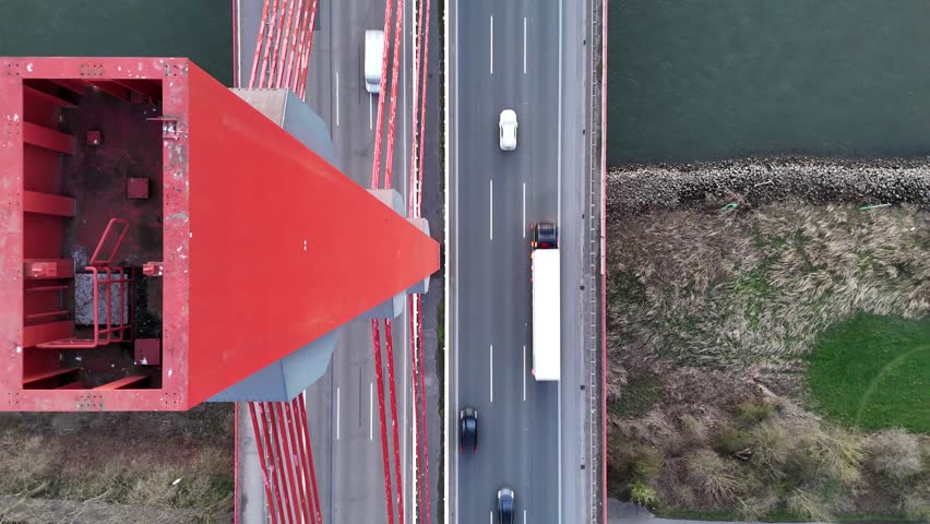 Unique angle looking down tower structure toward moving vehicles below
