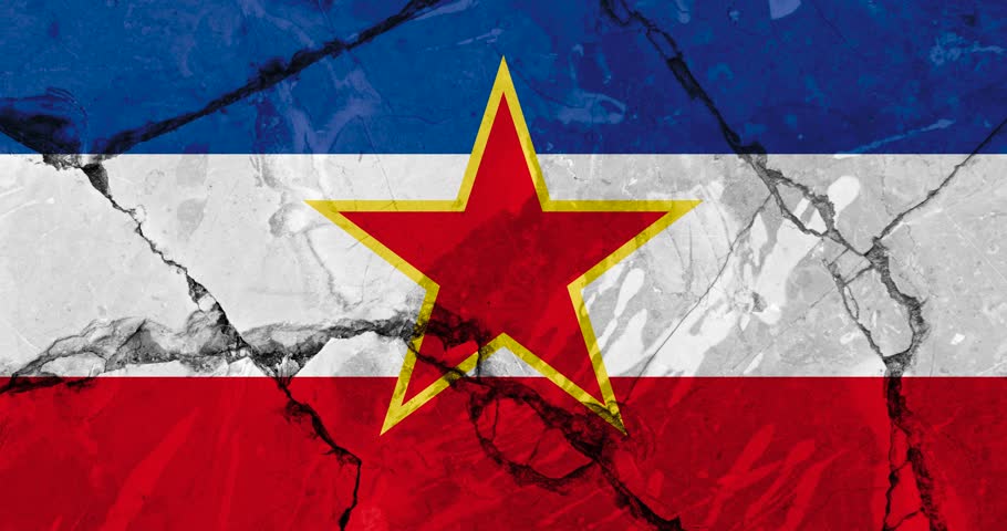 A zoom out video of an old grunge cracked wall with the yugoslavia flag