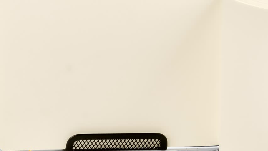 A clean desk setup shows the phrase Quality versus Quantity appearing on the pages of an open book.