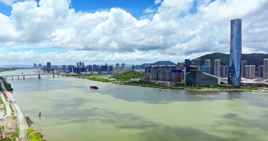 Aerial view of the modern urban skyline, river and scenic mountains in Zhuhai, China