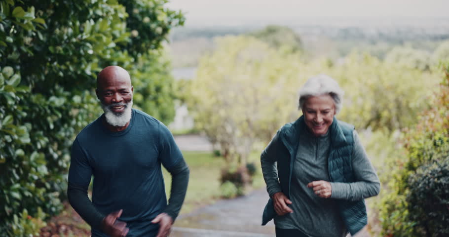 Fitness, running and senior couple in nature for exercise, training or wellness in morning. Sports, health and elderly man with woman for cardio workout, active or challenge together outdoor in park.