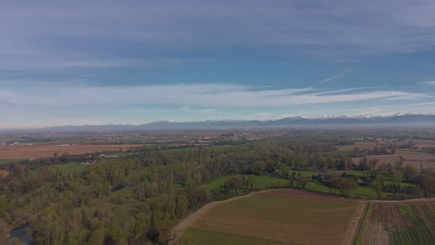 Aerial drone view of Parco Oglio Sud in Lombardy, Italy, featuring the winding Oglio River and surrounding natural landscape.