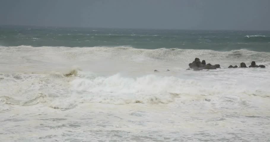 Ocean Waves During a Storm stormy weather sea wave hitting beach coral