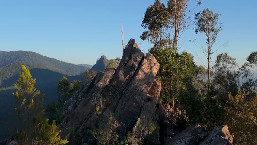 A dramatic view of Sugarloaf Peak seen from South Jawbone Peak, showcasing rugged ridgelines, layered mountain scenery, and sweeping wilderness vistas.