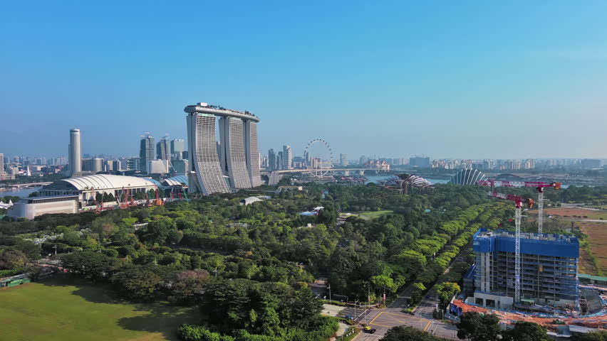 Marina bay, Singapore: Aerial view of famous island country and city-state - landscape panorama of Southeast Asia from above