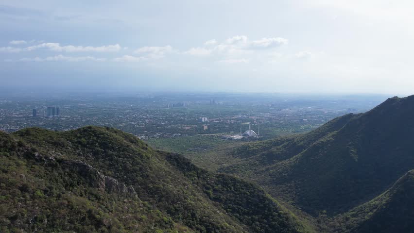 Faisal Mosque visible between green hills with Islamabad city spread across the background, Pakistan