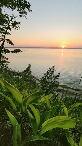 Beautiful sunset on a high river bank. Spring landscape.