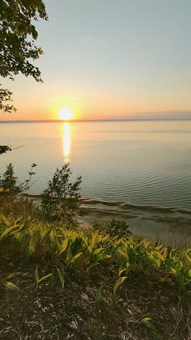 Beautiful sunset on a high river bank. Spring landscape.