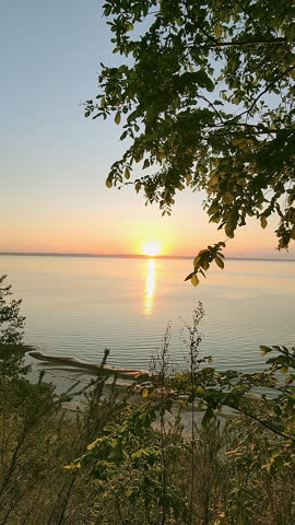 Beautiful sunset on a high river bank. Spring landscape.