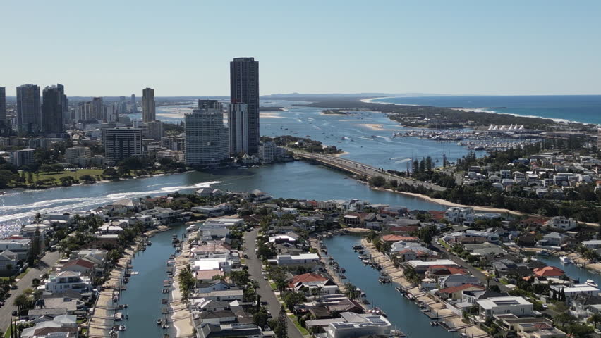 Aerial view of Gold Coast Queensland Australia with modern waterfront skyscrapers along Pacific Ocean coastline and vibrant urban cityscape