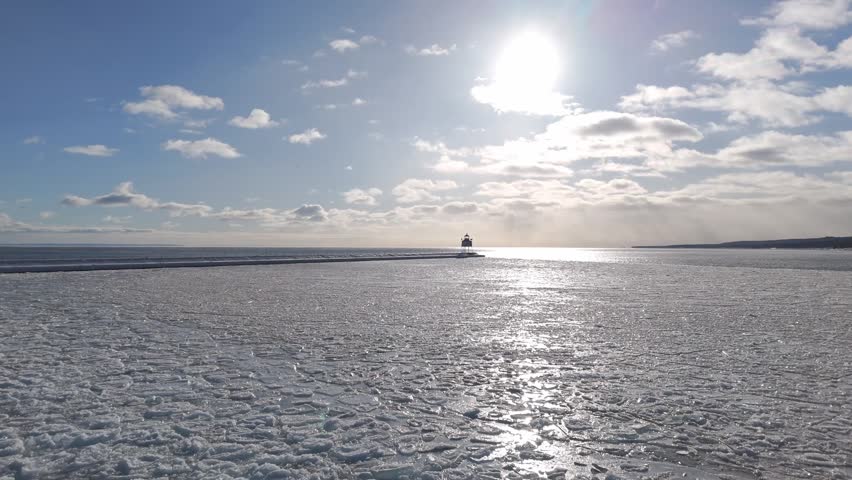 Beautiful afternoon during a warm sunset over frozen surface in two Harbors, Minnesota 3