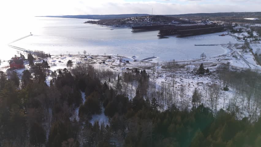 Bay at Two Harbors Minnesota during a winter sunset with Lake Superior frozen