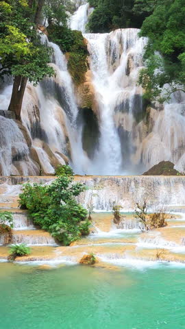 Scenic of Kuang Si Waterfall in Luang Phabang, Laos. Vertical footage.