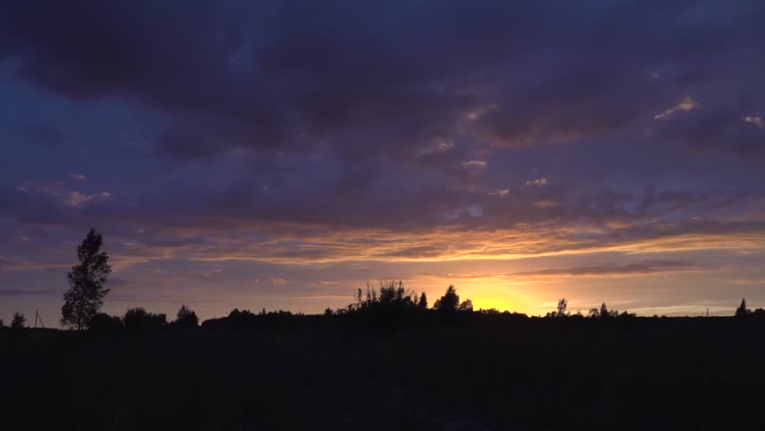 Sunset Silhouette of Trees and Clouds at Dusk
