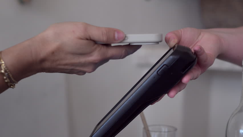 Person seen making a payment with their cellphone