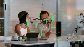 Vertical video: Analyzing data beanie tied-back team pointing in meeting as peer joining, green HUD. Collaboration, analytics, office, conference, technology, augmented, reality - Powered by Shutterstock - Get 15% off with code: PIKWIZARD15